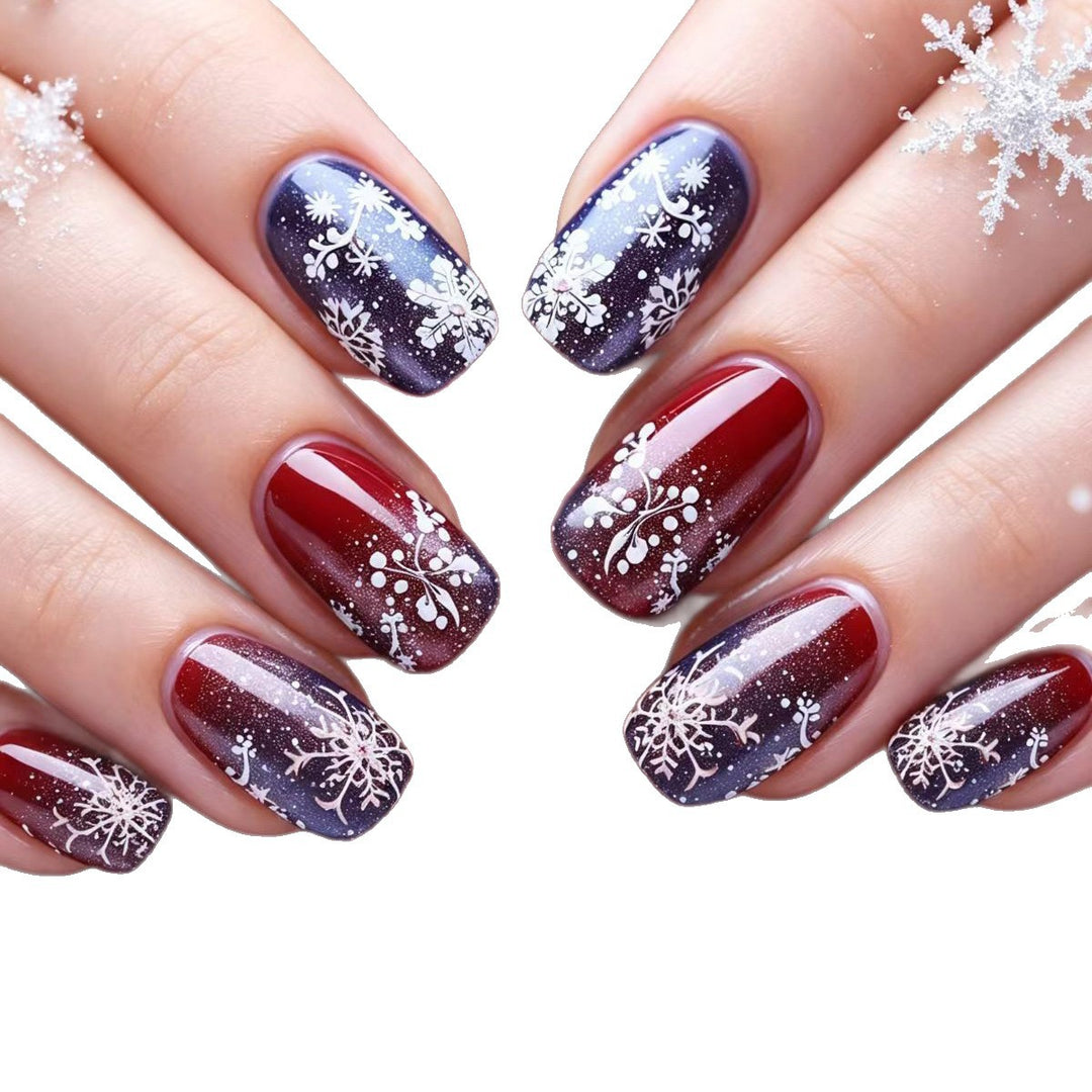 Artificial nails with festive glitter effect and wintry snow motif Stornfield