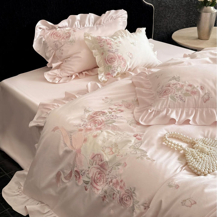 Romantic satin bed linen set with richly embroidered rose border and frill