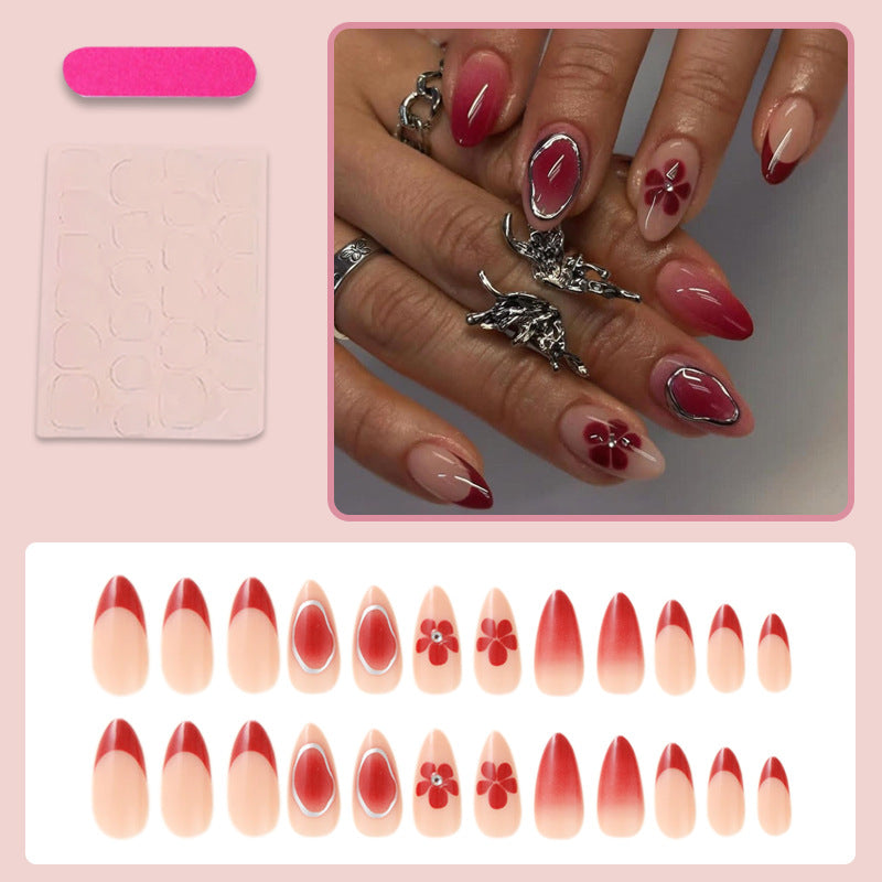 Artificial nail set with elegant flower and ombre accents Stornfield