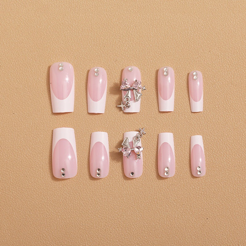 Artificial nail set with luxurious French tips and elegant embellishments Stornfield