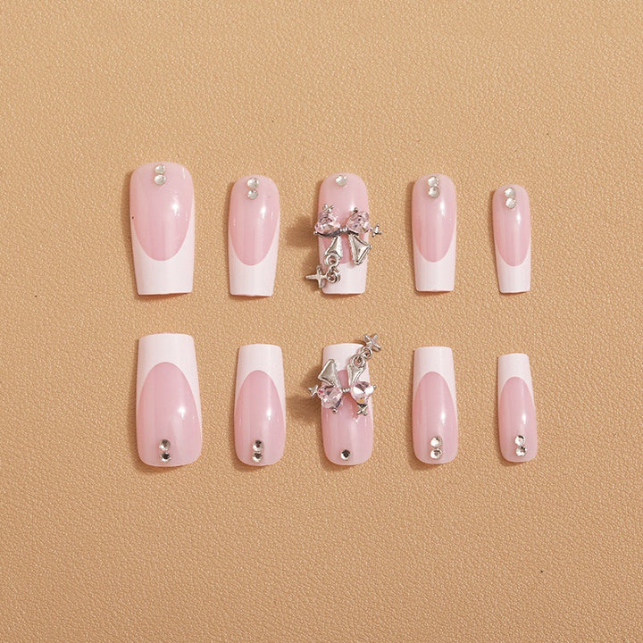 Artificial nail set with luxurious French tips and elegant embellishments Stornfield