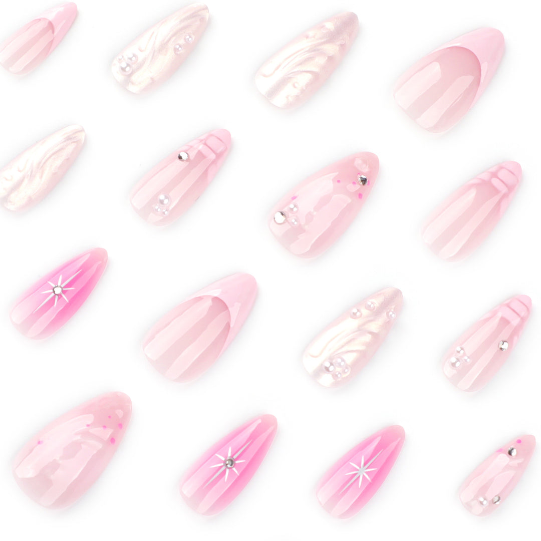 Artful Nail Extensions with Glitter and Shell Motifs Stornfield
