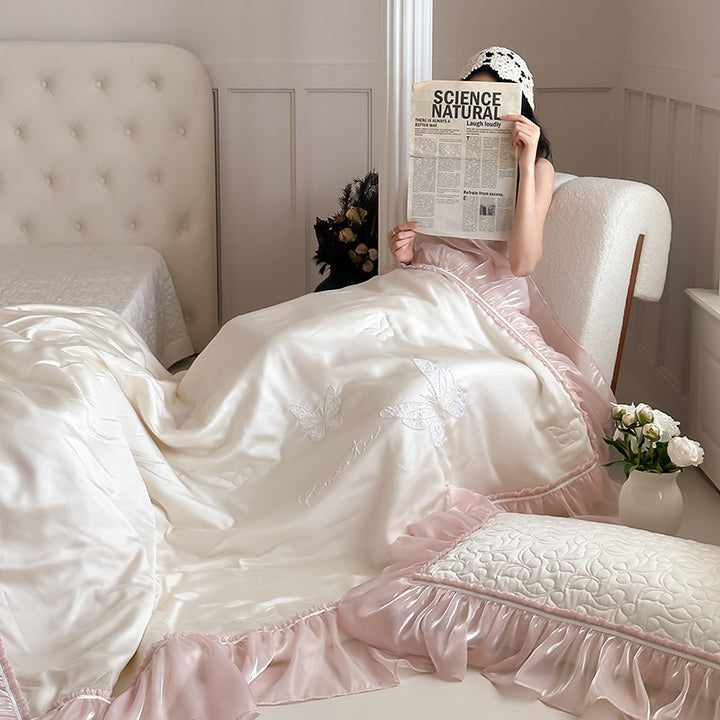 Luxurious satin bedding set with fine ruffle trimming & embroidered butterfly motifs