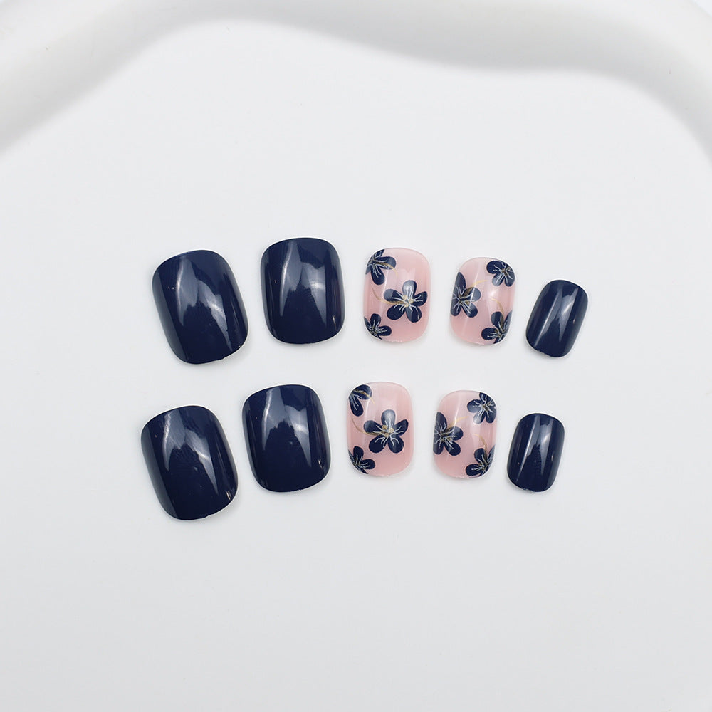 Artificial nails with floral designs and glossy accents Stornfield