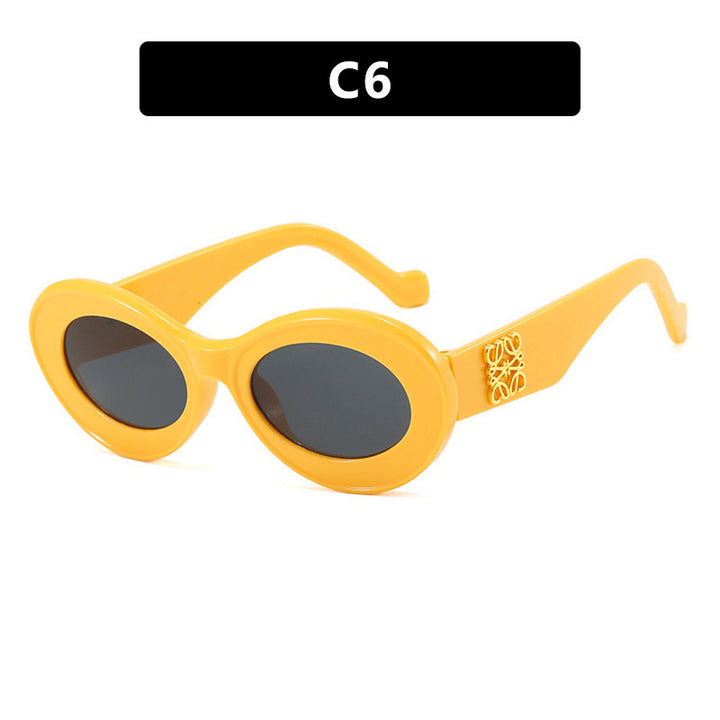 Women's fashionable sunglasses with oval frame and golden accents Stornfield