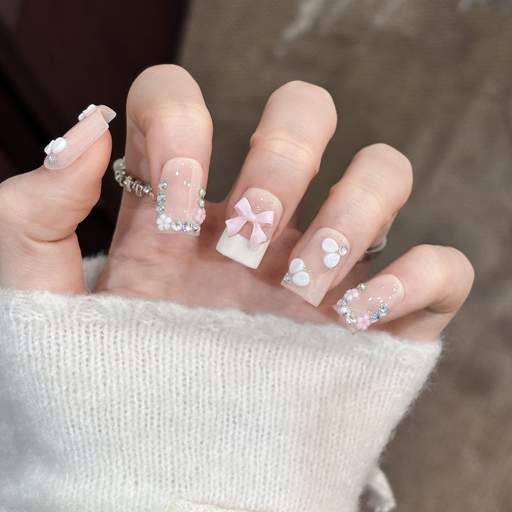 Decorative Nail Art Set with Floral Details and Bow Accents