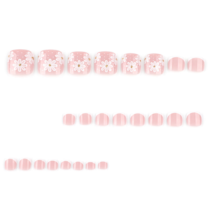 Artistic toenail art with elegant daisy motifs Stornfield