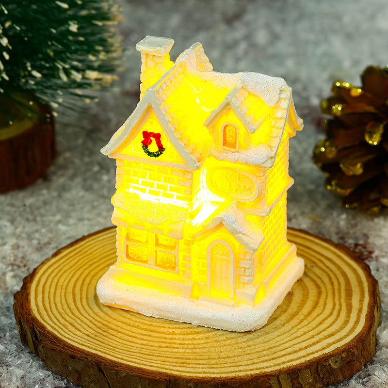 Illuminated Christmas village house with festive decoration Stornfield