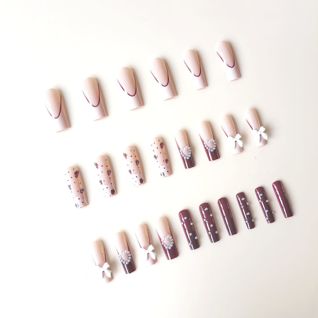 Artificial artificial nails with heart designs and holographic accents Stornfield