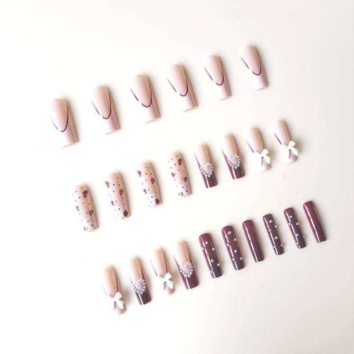 Artificial artificial nails with heart designs and holographic accents Stornfield