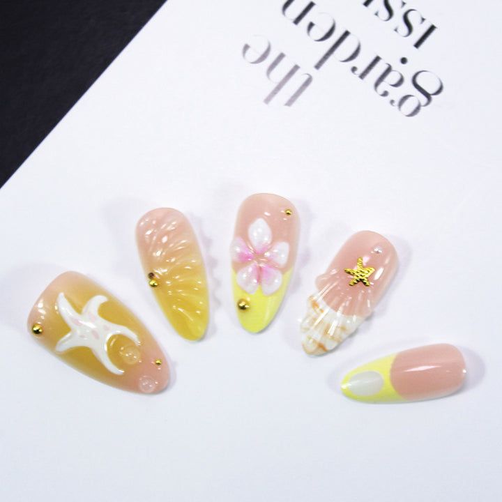 Artificial nail set with maritime shell and flower motifs Stornfield