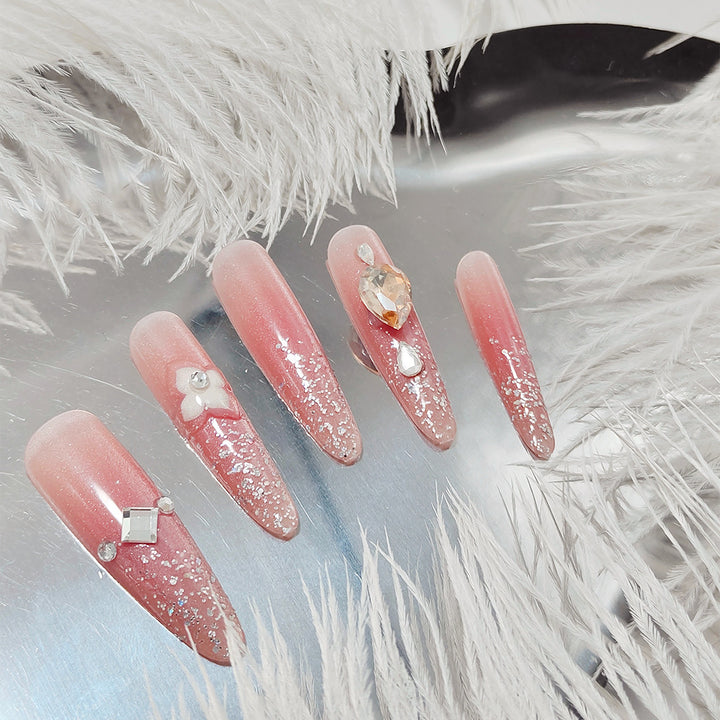 Shiny artificial nails with rhinestones and glitter Stornfield