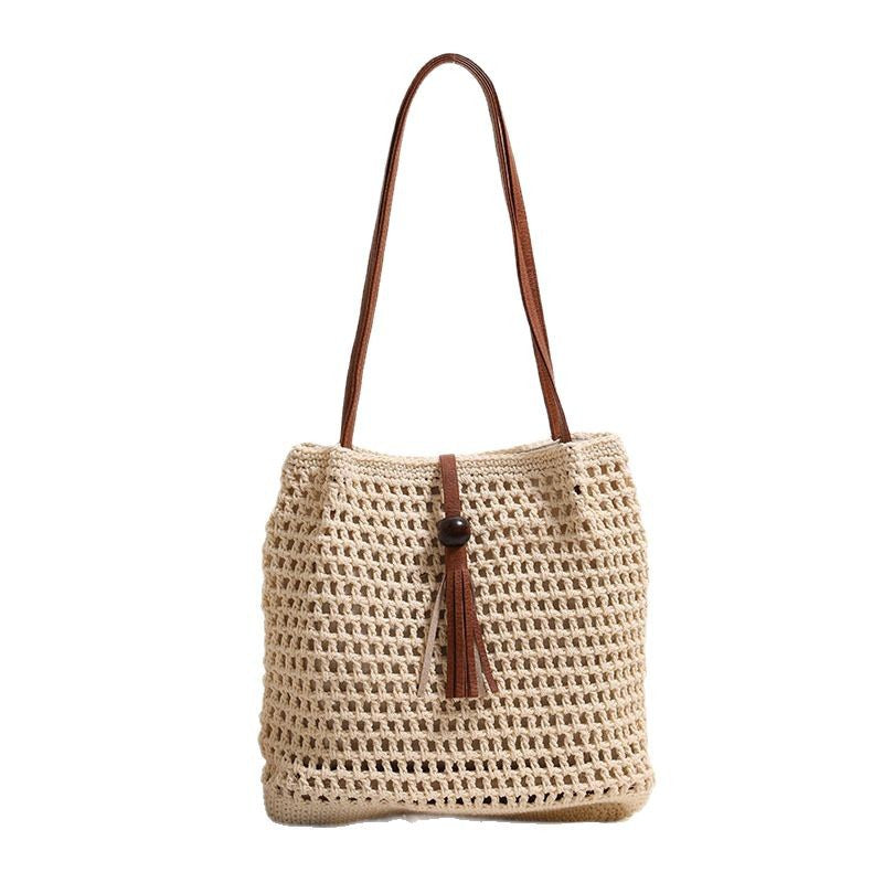 Hand-knotted basket bag with elegant leather handles Stornfield