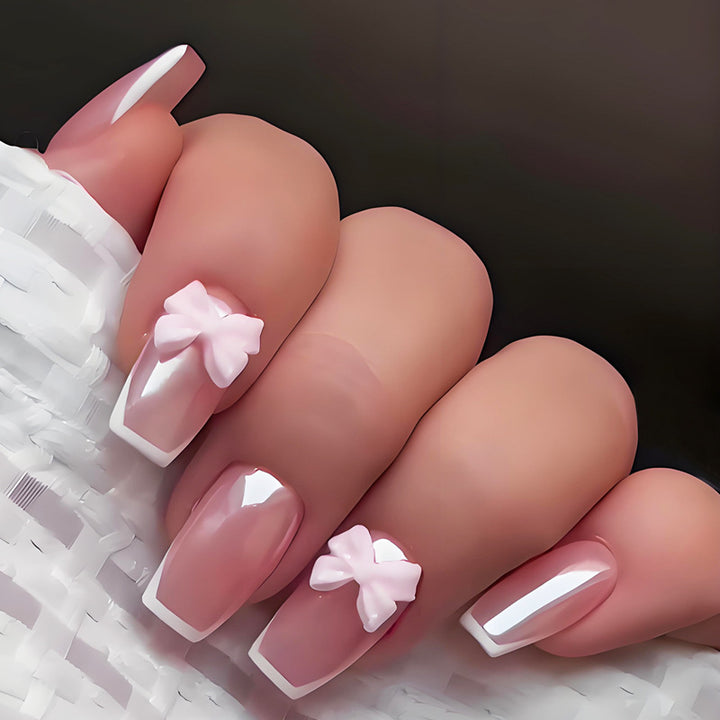 Artificial nail set with stylish bows and elegant French tips Stornfield
