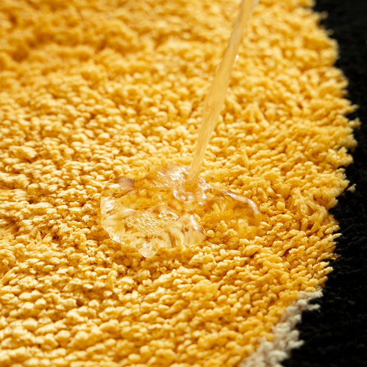 Playful children's rug in cheese shape with tufted chenille surface and non-slip backing Stornfield