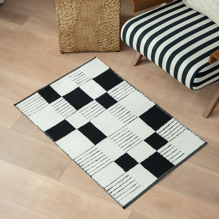 Modern runner rug with graphic checkerboard pattern and short pile structure Stornfield