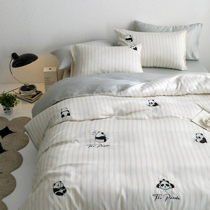 Reversible bedding set made of cotton percale with finely embroidered breakfast motifs