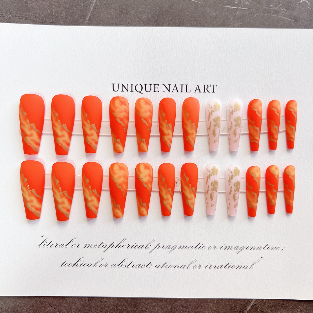 Artistic Press-On Nails with Gold Accents