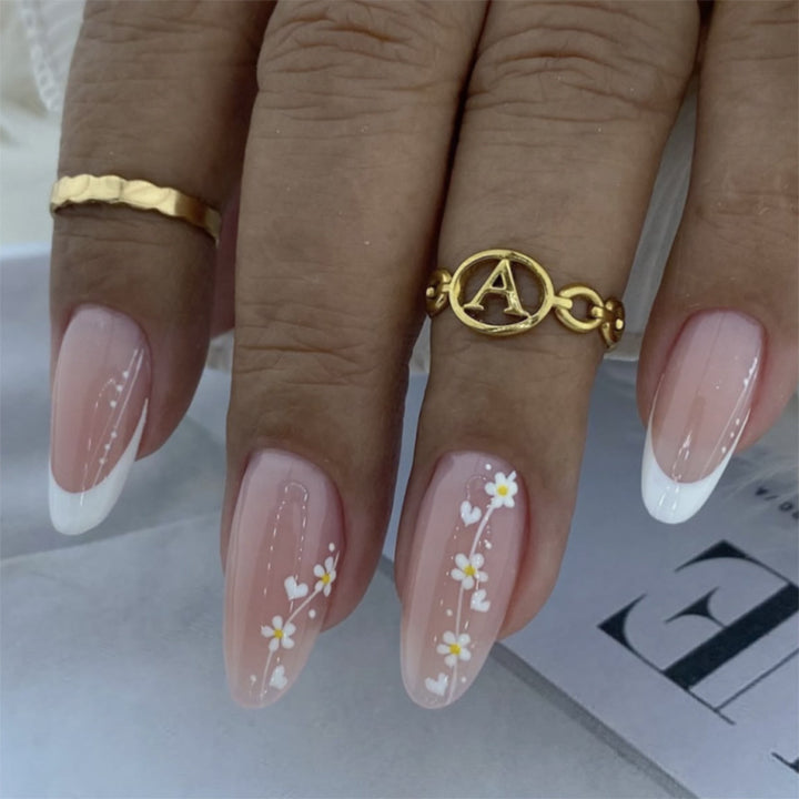 Artful Nail Extensions with Delicate Floral Patterns Stornfield