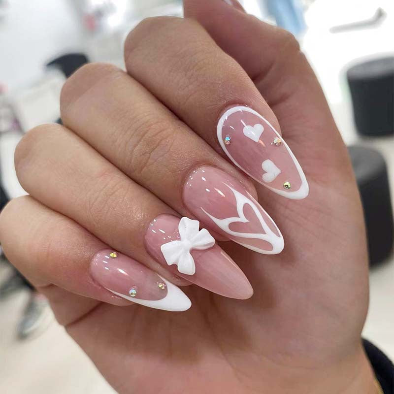 Artistic stiletto nails with heart design Stornfield