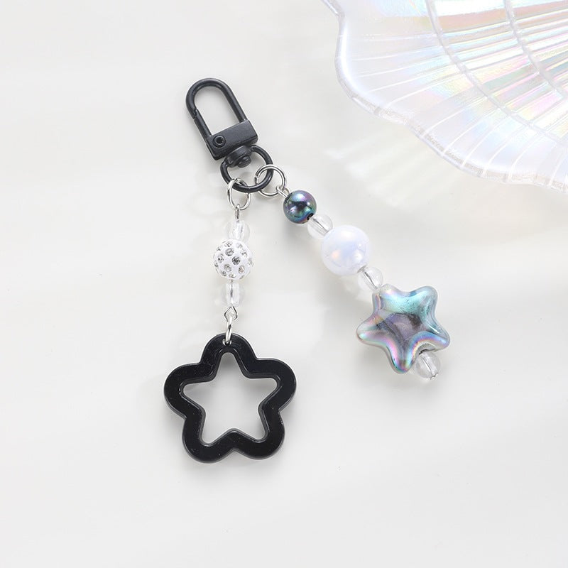 Playful keychain with floral and star motif Stornfield