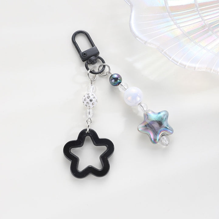 Playful keychain with floral and star motif Stornfield