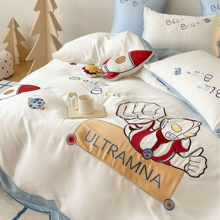 Children's satin bedding set with embroidered rocket and superhero motif