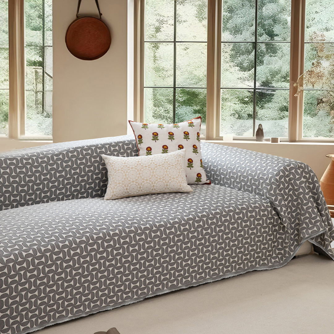 Washable sofa cover with geometric jacquard pattern and non-slip underside