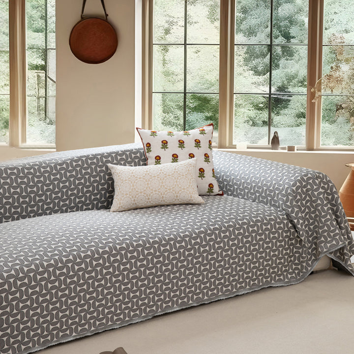 Washable sofa cover with geometric jacquard pattern and non-slip underside