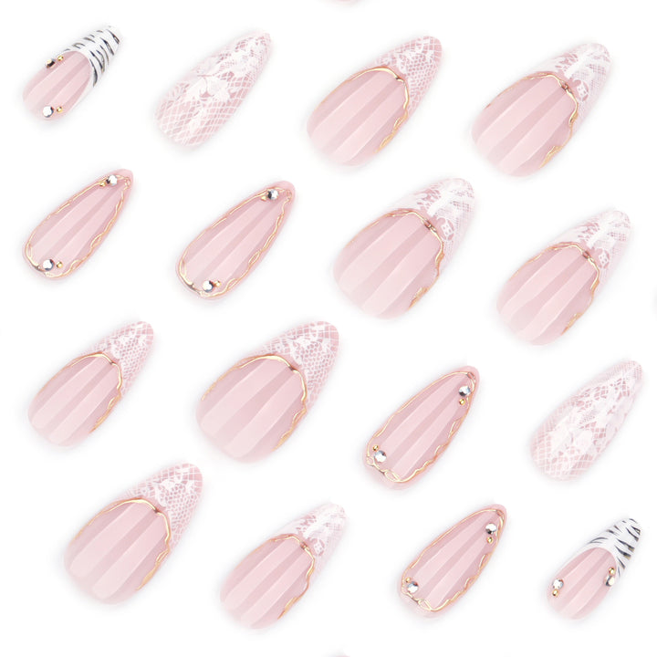 Artful stiletto nails with gold and tip embellishments Stornfield