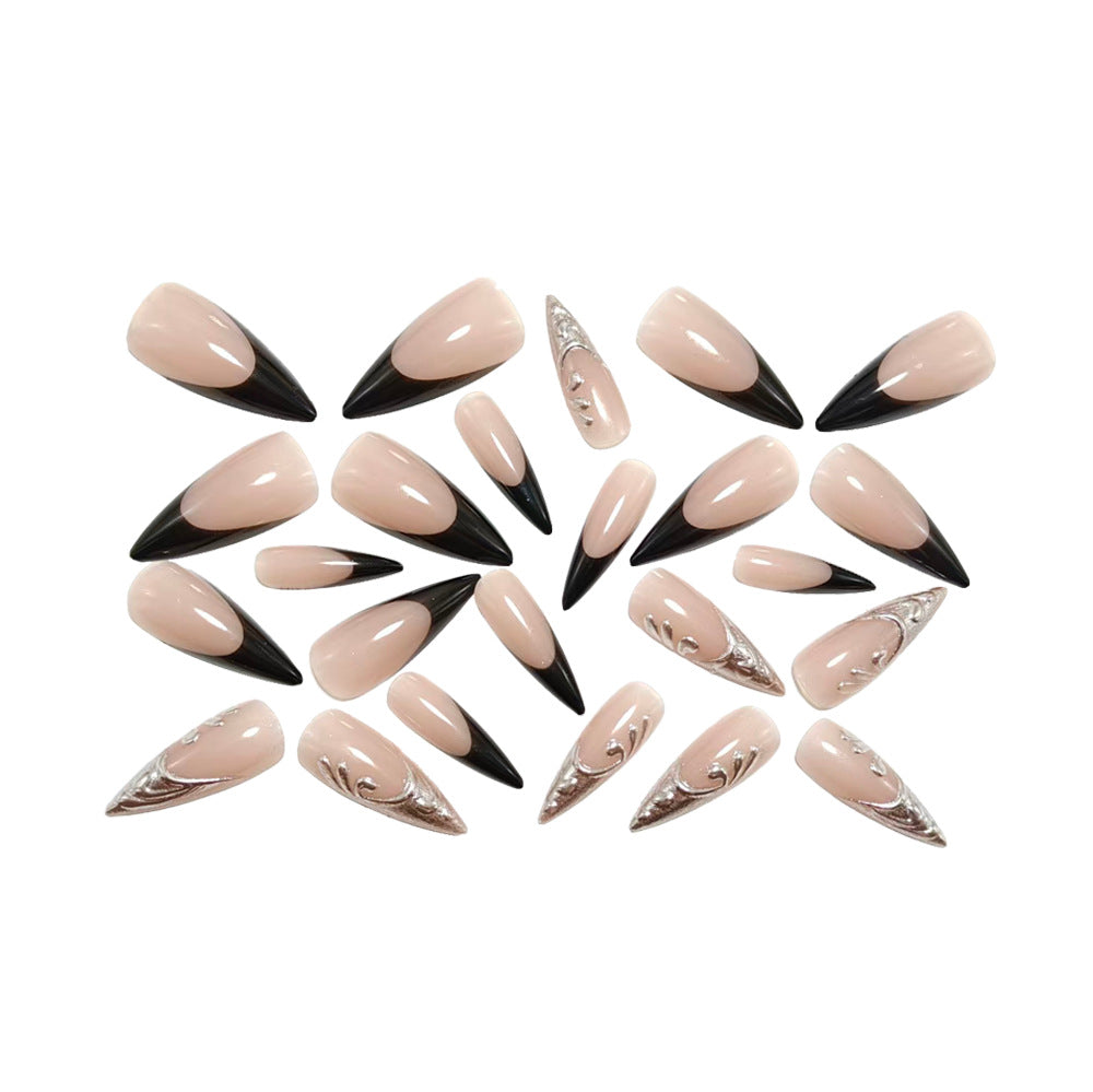 Artificial nails in elegant stiletto style with elaborate metal decoration Stornfield