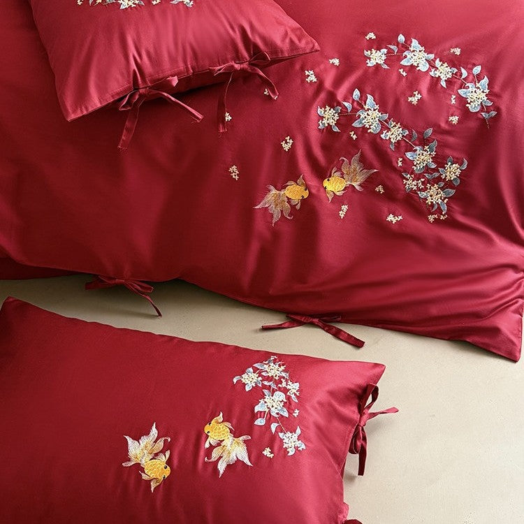 Luxurious satin bedding set with intricate floral-fish embroidery