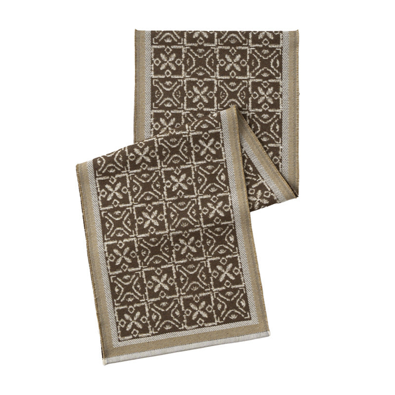 Decorative table runner with woven ornament jacquard and finely hemmed edges Stornfield