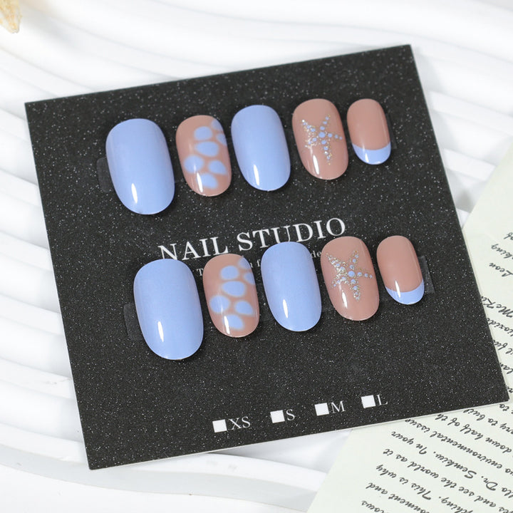 Artificial nail set with elegant patterns and glitter accents Stornfield