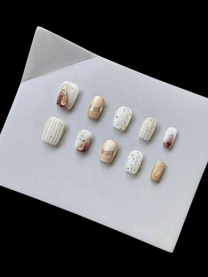 Elegant Decorative Press-On Nail Set with Gold and Marble Accents