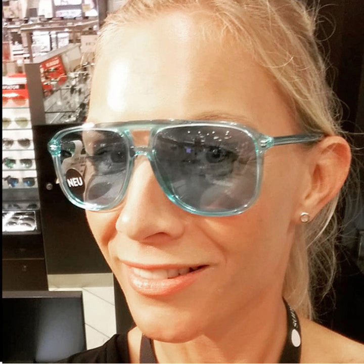 Women's fashionable sunglasses in transparent design with colored lenses Stornfield
