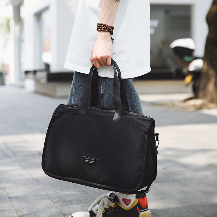 Sporty travel bag with ergonomic carrying handles and versatile compartments Stornfield