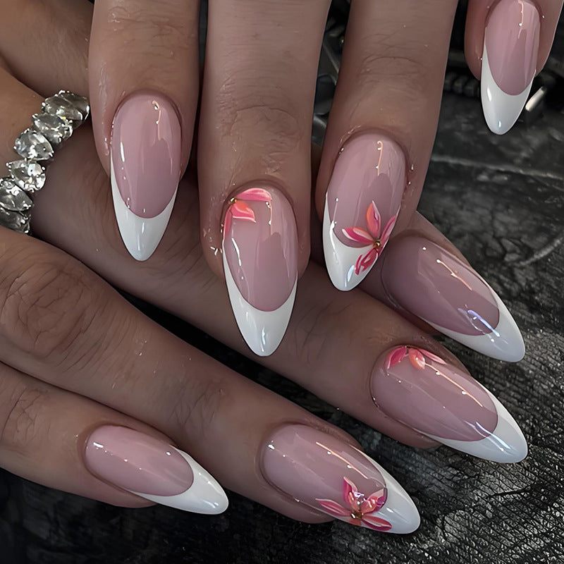 Artificial nail set with elegant French design and charming floral accents Stornfield