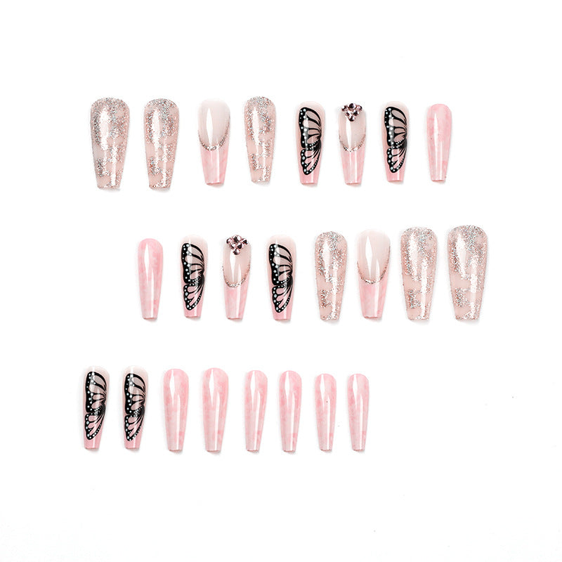 Glamorous nail extensions with beautiful butterfly motifs and glitter accents Stornfield