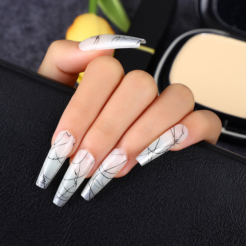Artificial nails in modern ombre design with marbled accents Stornfield