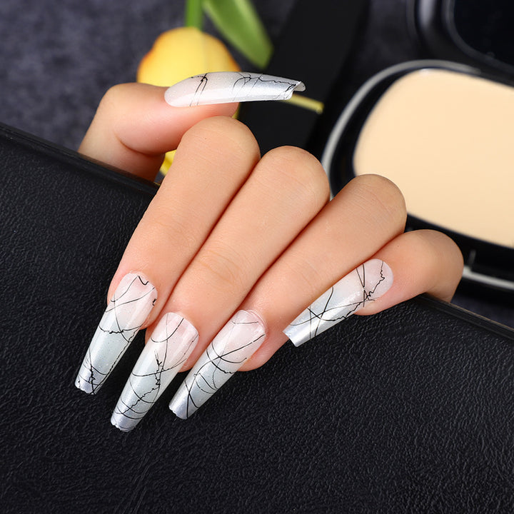 Artificial nails in modern ombre design with marbled accents Stornfield