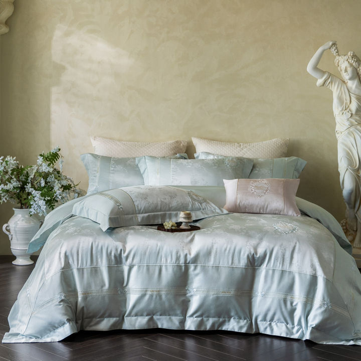 Luxurious satin bedding set with embroidered medallions and elegant quilting