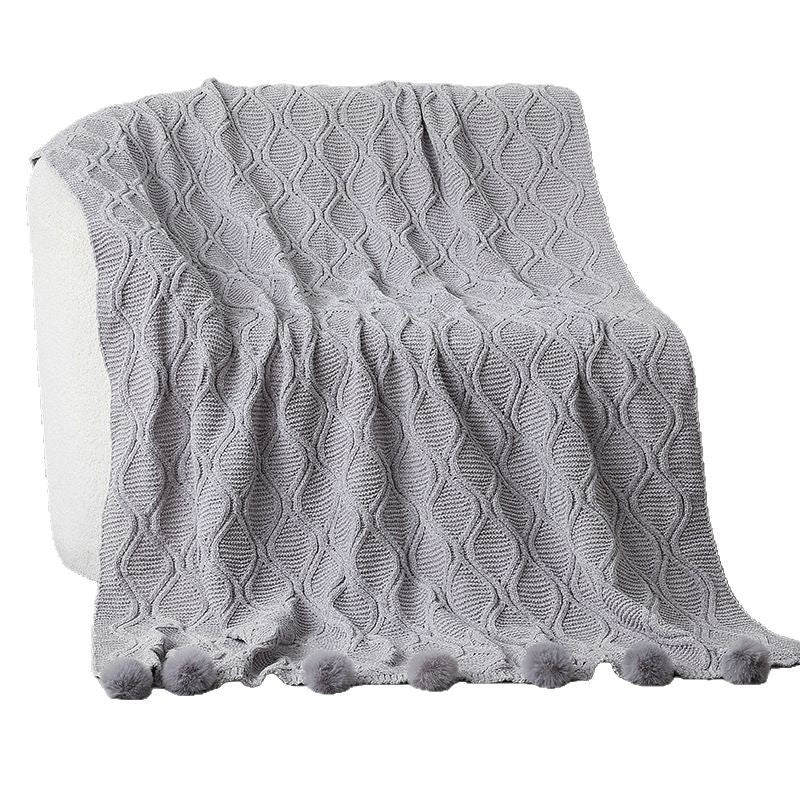 Ladies knit blanket with decorative pom poms Stornfield
