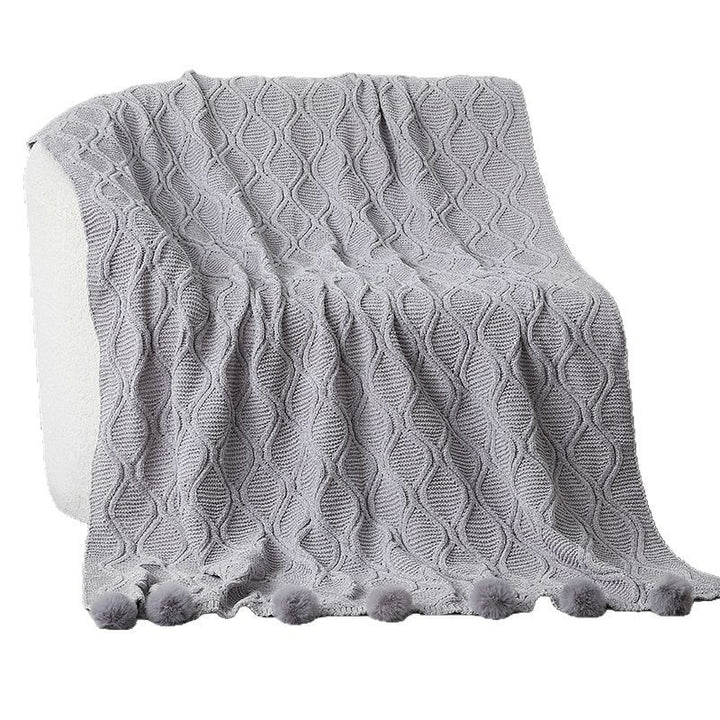 Ladies knit blanket with decorative pom poms Stornfield