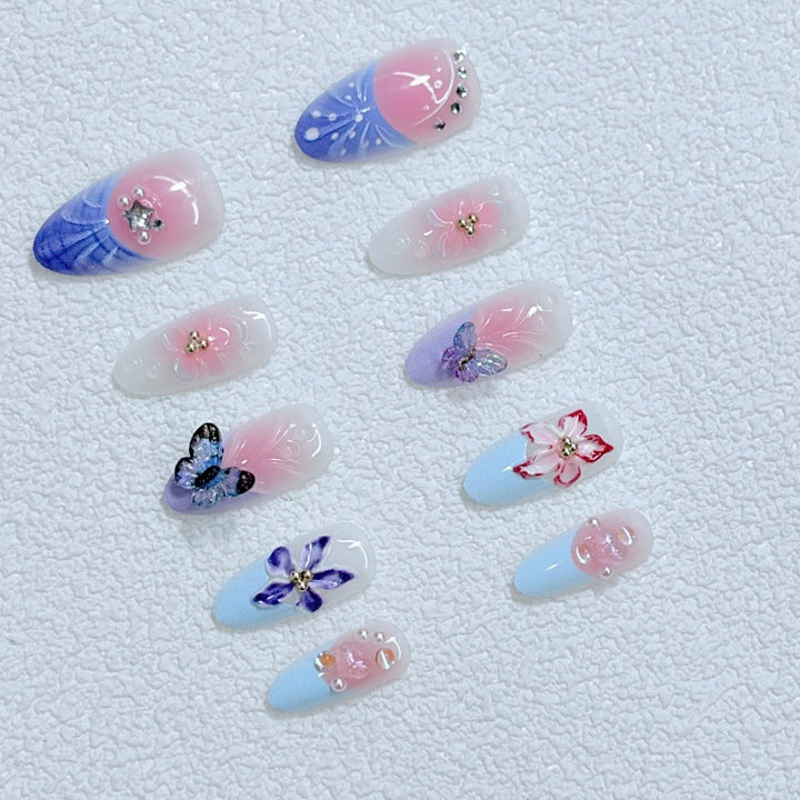 Artful Nail Art with Floral Details and Butterflies Stornfield
