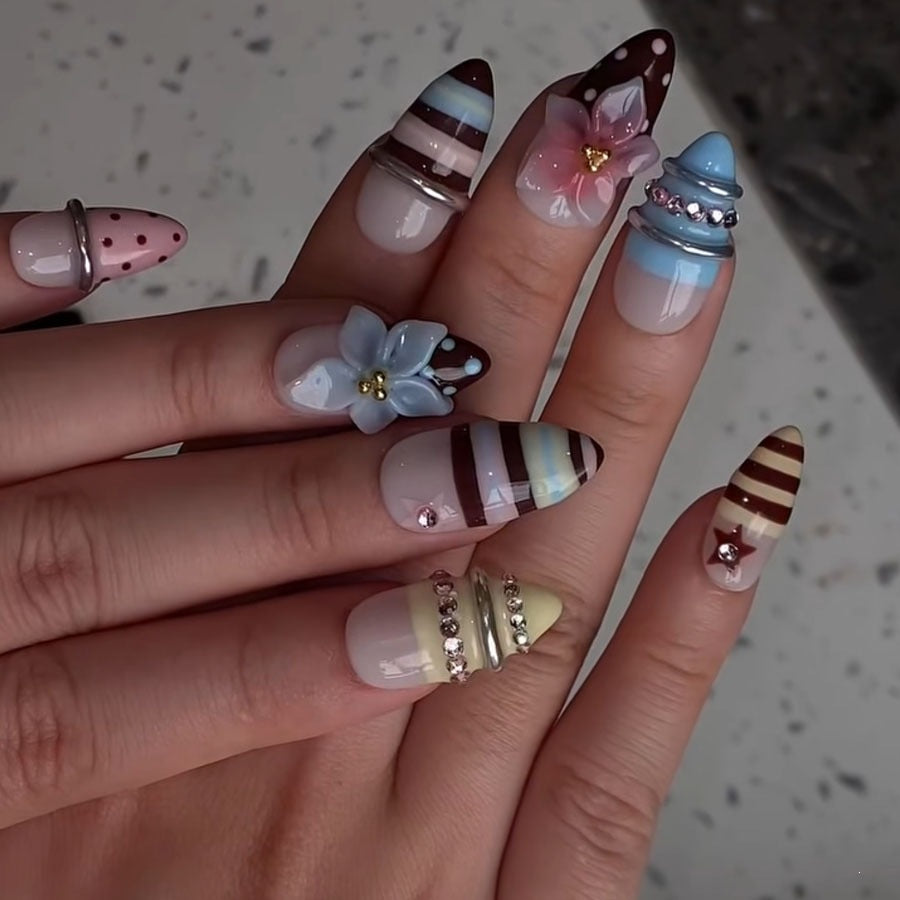 Creative nail art set with floral and striped accents Stornfield