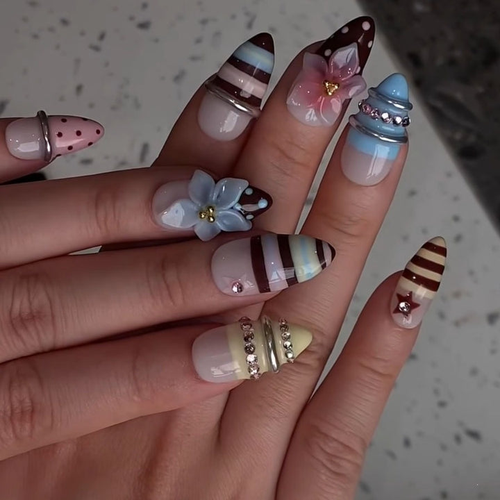 Creative nail art set with floral and striped accents Stornfield