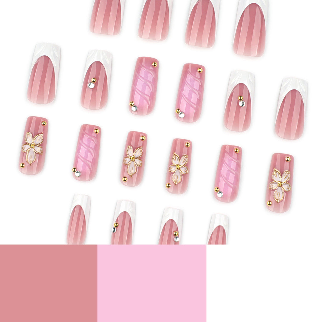 Glamorous gel nails with floral accent and glitter details Stornfield