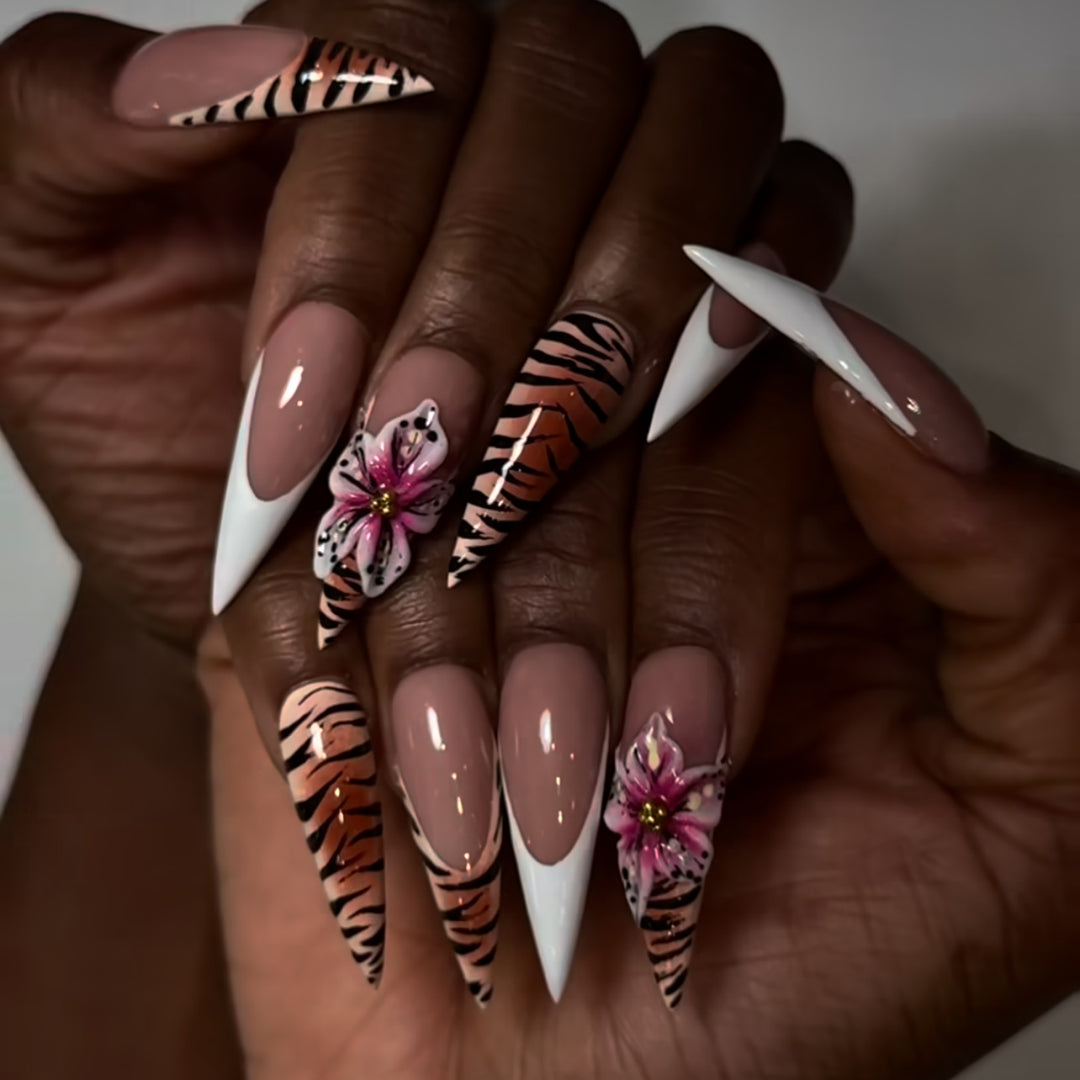 Artful stiletto nails with floral and animal design Stornfield