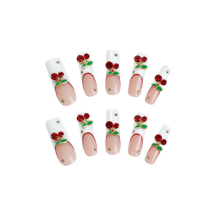 Artificial nail set with cherry motif and sparkling rhinestones Stornfield